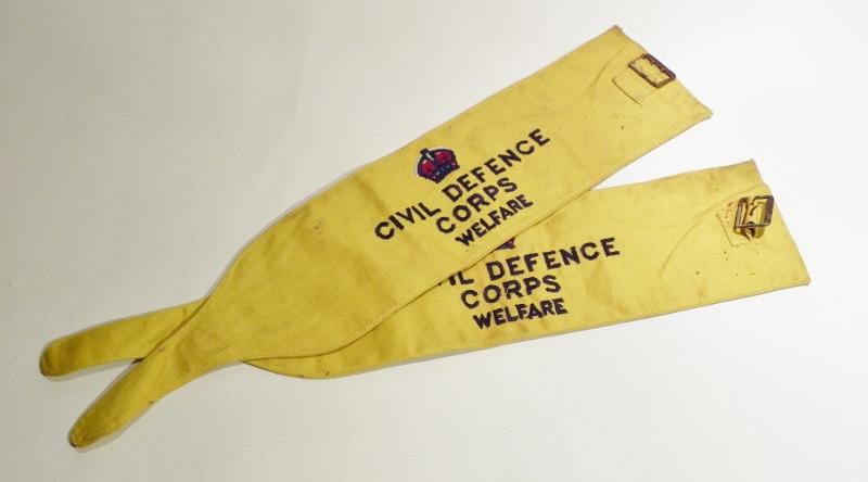 A Pair of Military Marked 1953 Dated Civil Defence Corps Arm Band